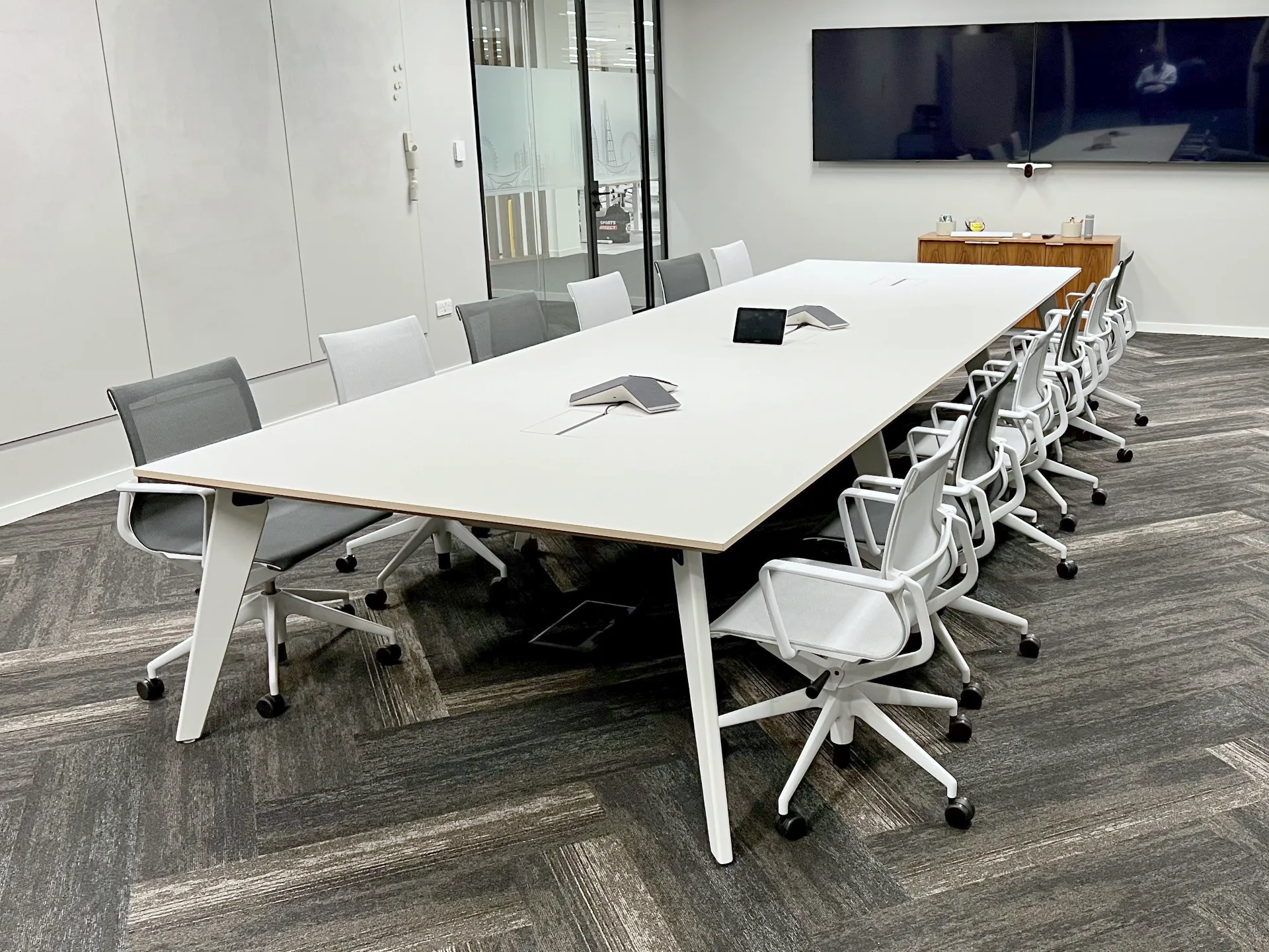 Bespoke Fenix meeting table with Farrow and Ball painted legs and custom frame